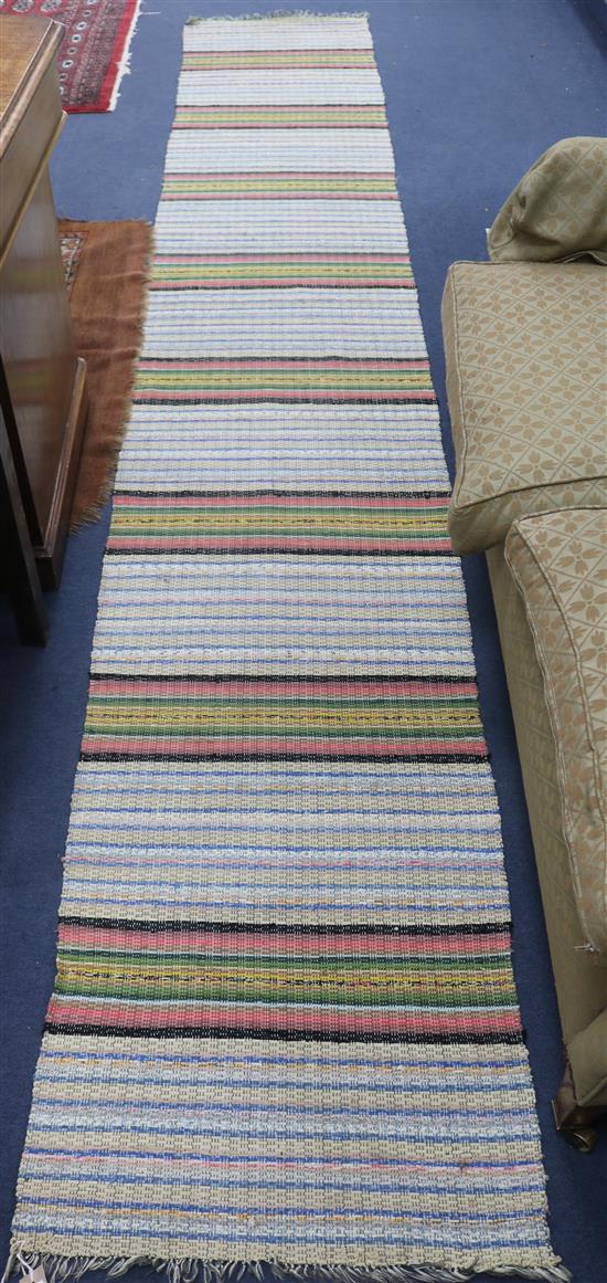 A flatweave rug, 360 x 60cm